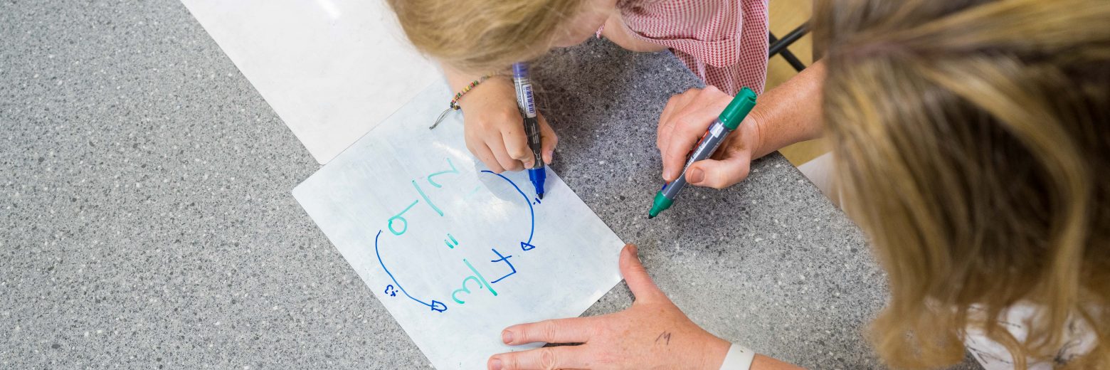 Teacher and student practicing sums