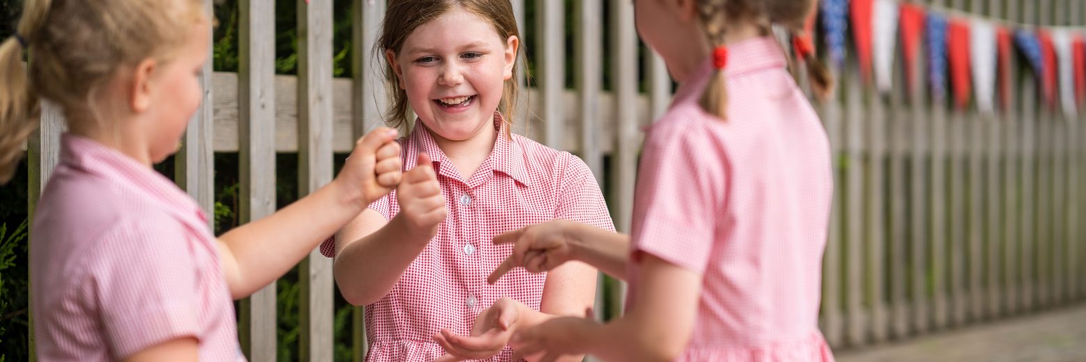 Girls playing rock paper scissors