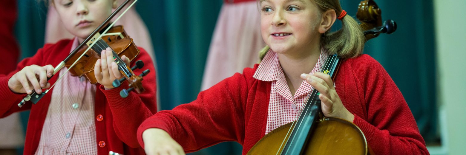 girls playing the violin